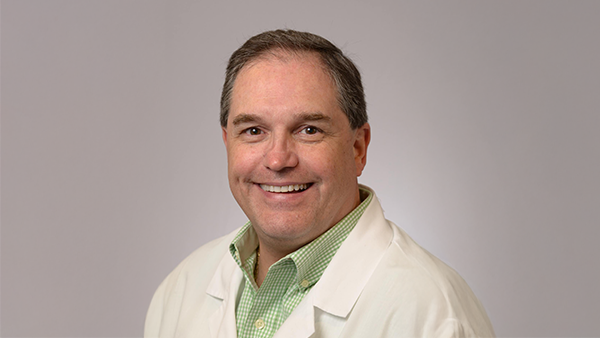 Orthodontist P. Todd Bonner In Lab Coat Smiling